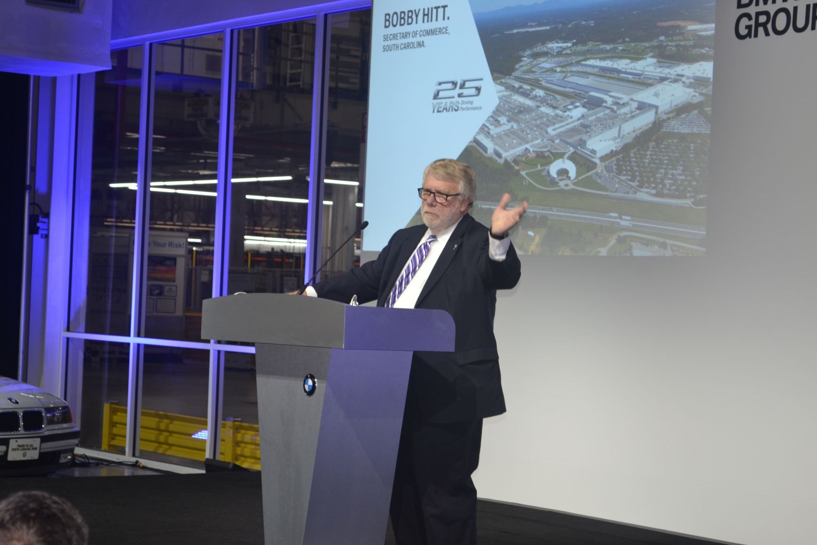 Commerce Sec. Bobby Hitt speaks at a BMW Manufacturing event. The plant is one of the state's recruitment successes, originally promising 2,000 jobs and creating 11,000. (Photo/Ross Norton)