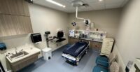 The first area to open at the new AnMed campus near the fast-growing Powdersville area will be the AnMed Piedmont emergency department. (Photo/AnMed)|A preview event for media and supporters of AnMed drew a crowd on May 5 as preparations moved into the final stages of the AnMed Piedmont emergency department. (Photo/AnMed)|Sen. Lindsey Graham chats with AnMed CEO William Kenley and Dr. Tara Drew, medical director of the AnMed Medical Center emergency department, during a tour of the new Piedmont facilities. (Photo/AnMed)|