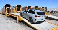 A BMW X3 is loaded onto a railcar at Plant Spartanburg, later bound for export at the Port of Charleston. (Photo/Steve Wilson)|BMWs from Plant Spartanburg wait to be loaded for export at the Port of Charleston. (Photo/Fred Rollison)