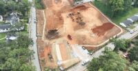 Site preparation continues to advance, with clearing and grubbing complete, erosion control measures nearly finished, and crews preparing to install underground utilities. (Photo/P+F Construction)