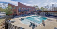 Trinity Partners closed the $10.5M sale of Elements West, a 60-unit Greenville apartment developed from a historic cotton warehouse. (Photo/Trinity Partners)