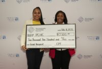 Palmetto Community Health Care’s Clinic Coordinator, Nadylie Woods (left), and Executive Director, LaTiffany Morrison (right), receive their grant at The Community Partnership Foundation’s 2025 Spread the Love Luncheon . (Photo/The Community Partnership Foundation)