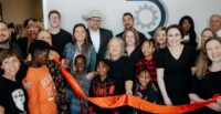 Staff members and their families celebrate the opening of the first official office for R&R Resolute Staffing Firm on Old Buncombe Road in Greenville. (Photo/R&R Resolute Staffing Firm)