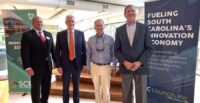 Randy Cutts, SCRA director of facilities; Rep. Jason Elliott, SCRA Board of Trustees; Greenville Mayor Knox H. White; and Bob Quinn, SCRA president and CEO, celebrate the new Greenville office. (Photo/SCRA)