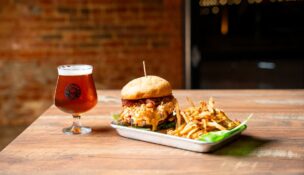 Voodoo Brewing Co. Lexington will feature a rotating selection of Voodoo Brewing Co.’s craft beers, brewed in Meadville, Pa., alongside a menu of elevated pub fare developed locally for the Lexington community. (Photo/In The Black)|The taps are about to flow on Main Street as Voodoo prepares to open at 102 W. Main St., Suite A, in the heart of heart of downtown Lexington. (Photo/In The Black)|Voodoo Brewing Co. Lexington is owned and operated by Dawu Bowman. (Photo/In The Black)