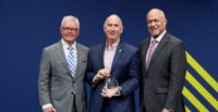 Dave Edwards, president and CEO of GSP, accepts the award from Kevin Burke, president and CEO ACI-NA and Kevin Dolliole, chair of the ACI-NA Board of Directors. (Photo/ACI-NA)