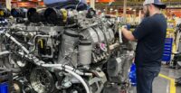 A worker at the Rolls-Royce plant in Aiken works on one of the large engines produced at the site. (Photo/Rolls-Royce Solutions America)