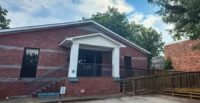 Colliers’ Mary Winter Teaster and Sydney Lanham represented MIRCI in a sale that will lead to a school at a former center for the homeless. ((Photo/Colliers)