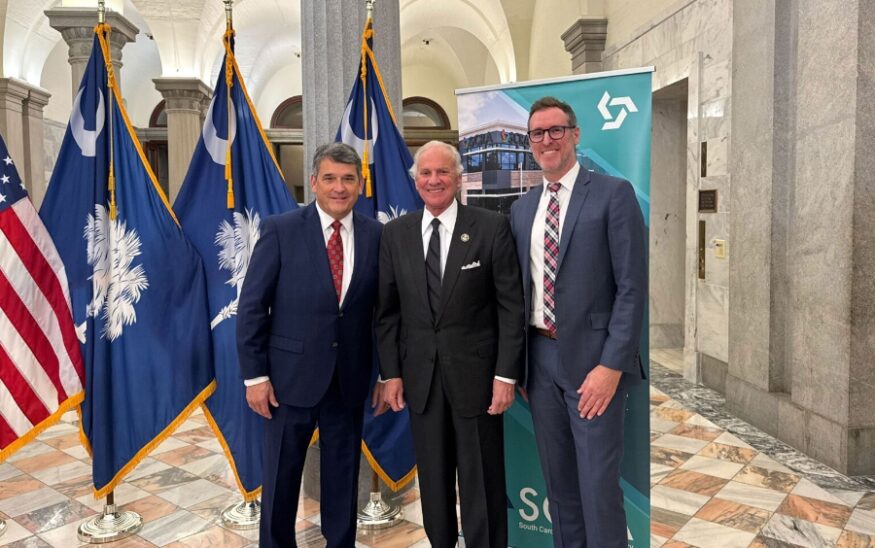 Pictured (left to right): William “Bill” Kirkland, SCRA interim president and CEO, Governor Henry McMaster, Brian Shea, co-founder and principal at Simon Everett, Ltd. (Photo/South Carolina Research Authority)