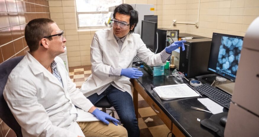 Dong Hou (right) works with Ph.D. student Bryson Hedrick in an Olin Hall lab at Clemson University. (Photo/Clemson University)