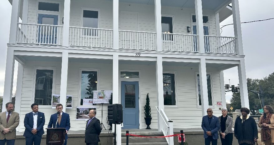 Officials from the city of Charleston and Charleston Redevelopment Corp. dedicate four new housing units at 89 Fishburne St. (Photo/City of Charleston)