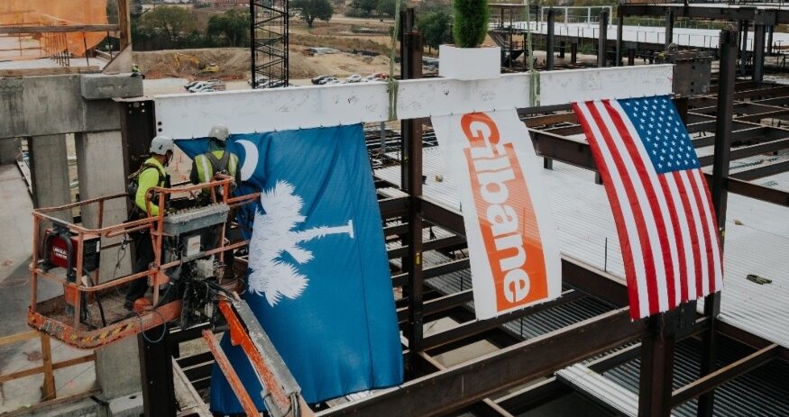 Gilbane and USC representatives topped out the university’s $300 million School of Medicine building in Columbia’s BullStreet District, marking a major milestone for the health sciences project. (Photo/University of South Carolina)