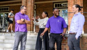 Boyd Scholars Amy Jordan and Breyon Dent (center) talk with lecturers Joe Chappa (left) and Michael Kiernan on the steps of Holtzendorff Hall, the historic YMCA building on campus. (Photo/Clemson University)