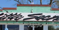 The owners of Little Secret went in for a little whimsy — in their sign, their décor and their menu. (Photo/Stephanie Kalina-Metzger)