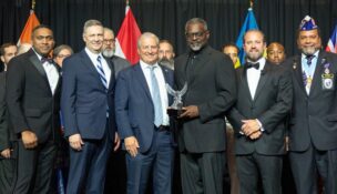 Lionel "T.K." Kennedy, CEO of Midlands STEM Charter School, accepts the inaugural Valor in Education Award from the Charter Institute at Erskine in recognition of his military service and dedication to education. (Photo/Midlands STEM Charter School)