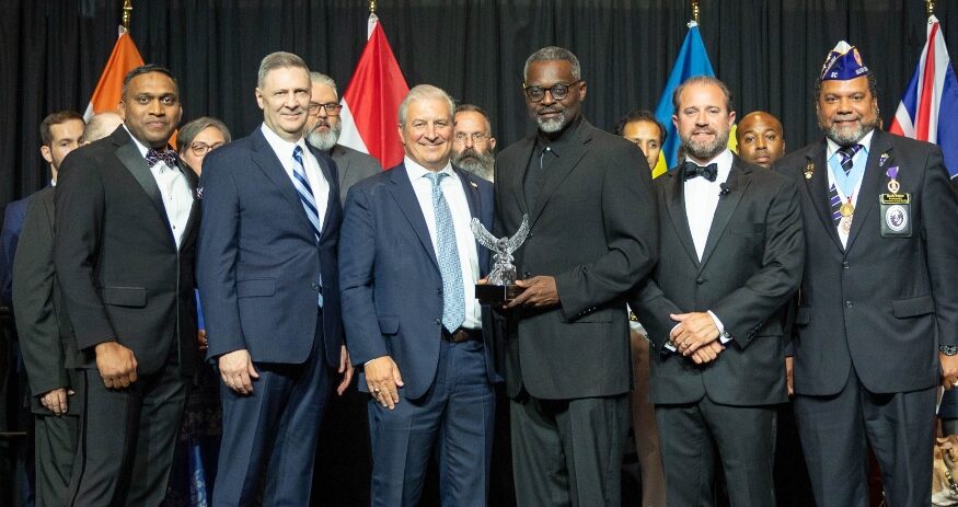 Lionel "T.K." Kennedy, CEO of Midlands STEM Charter School, accepts the inaugural Valor in Education Award from the Charter Institute at Erskine in recognition of his military service and dedication to education. (Photo/Midlands STEM Charter School)