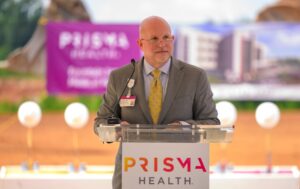 Justin Benfield, CEO of Prisma Health Laurens County Hospital and Prisma Health Hillcrest Hospital, speaks during the groundbreaking ceremony for Prisma Health's $180 million Fountain Inn Medical Park on June 30. (Photo/Prisma Health)