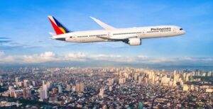 A Boeing 787-9 Dreamliner flies above Manila. Philippine Airlines has committed to growing its fleet of North Charleston-made jets. (Photo/Boeing)