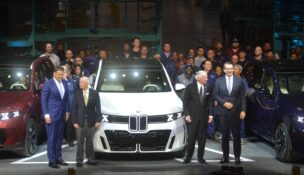 Milan Nedeljković, chairman of the Board of Management, BMW AG; Sen. Lindsey Graham, Gov. Henry McMaster and Robert Engelhorn, president and CEO of BMW Manufacturing Co., join the men and women who assemble the automobiles for the new BMW X5 debut. (Photo/Ross Norton)