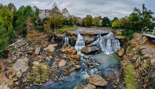 Auro Hotels and Marriott executives joined Greenville leaders to announce plans to transform the historic Bowater Building into South Carolina's first JW Marriott hotel, a centerpiece of the Falls Park Conference District. (Photo/DepositPhotos)